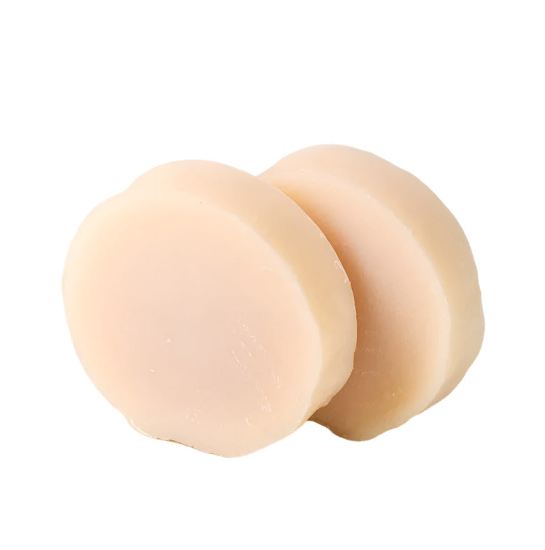 Close-up of the leaf-shaped shaving soap bar’s textured surface with subtle green marbling and embossed leaf logo detail.