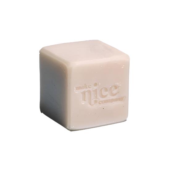 Close-up of the Mint Eucalyptus Solid Dish Soap bar’s textured surface and embedded eucalyptus leaf accents, highlighting