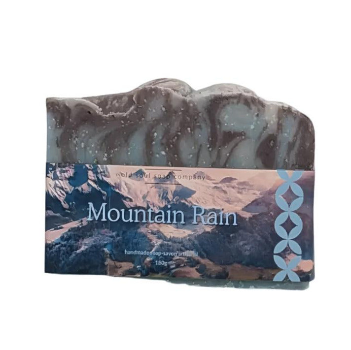 Mountain Rain fragrance soap bar by Old Soul Soap Company with swirling blue and green marbled surface, 4x2 inches
