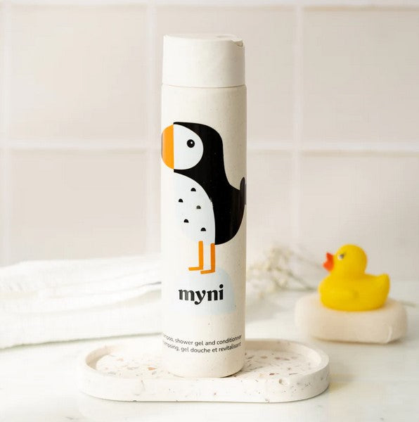 Close-up of the Myni 3-in-1 Kids Starter Kit shampoo bottle displaying the gentle, tear-free formula and playful label design