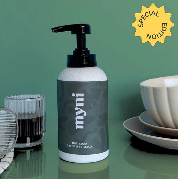 Myni dish soap bottle with clear plastic container, white screw cap, and green label featuring product details and branding