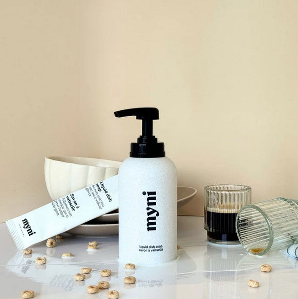 Close-up of the Myni Dish Soap Bottle’s textured, squeezable plastic body with vibrant green color and ergonomic grip