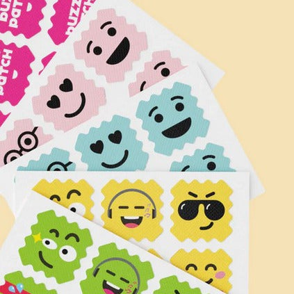 Close-up of the BuzzPatch sticker’s textured surface showing embedded mosquito-repellent ingredients and vibrant cartoon