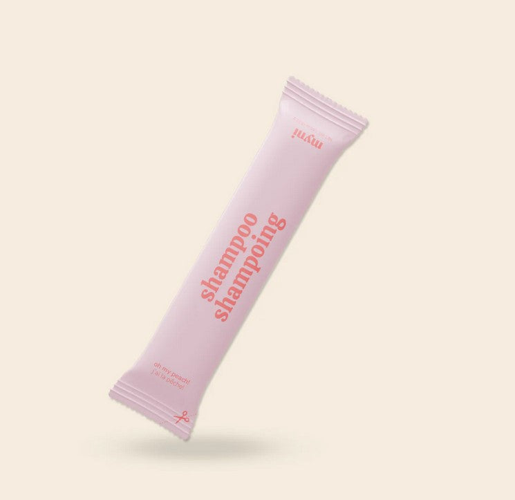 Close-up of Myni Shampoo Starter Set bottle displaying natural ingredients and textured label detail