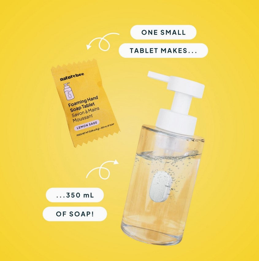 Close-up of foaming soap tablets inside transparent container showing textured granules and fresh lemon sage label detail