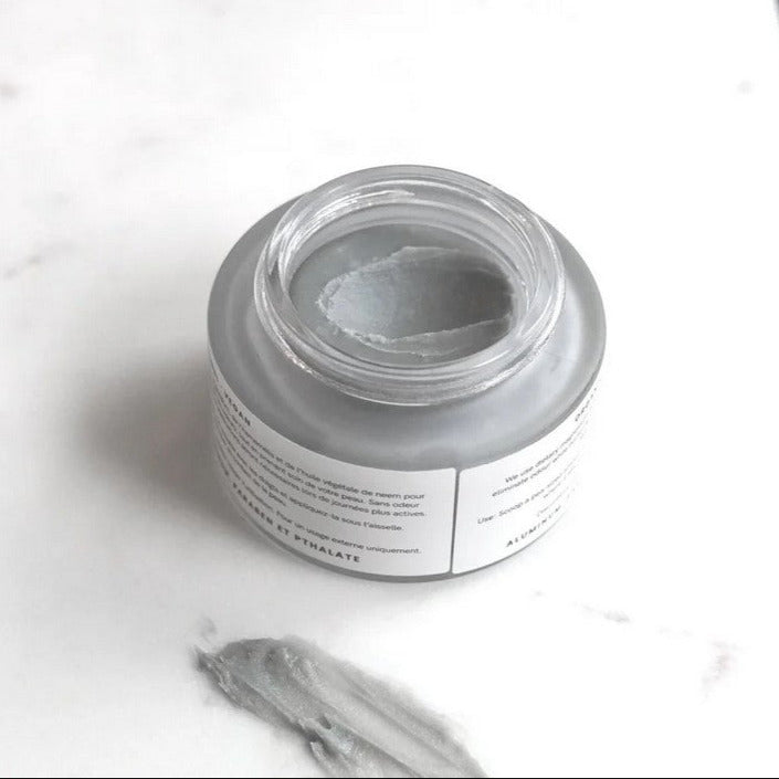 Close-up of Dom’s Deodorant Baking Soda Free paste showing smooth, creamy texture and light beige color with visible