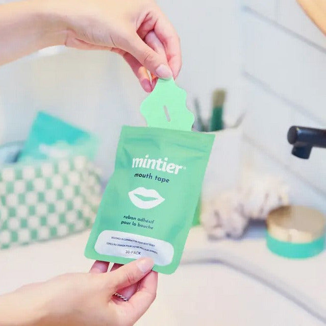 Close-up of Mintier Mouth Tape’s transparent, textured silicone surface with mint green backing and rounded edges for comfort