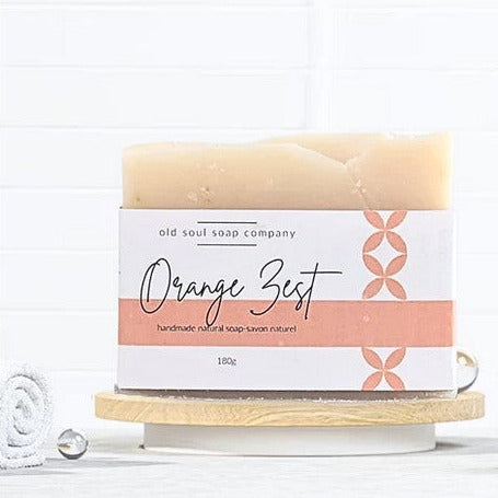 Vegan orange zest artisan soap bar from Old Soul Soap Company, textured bright orange surface, 4x2 inches, hand-cut style