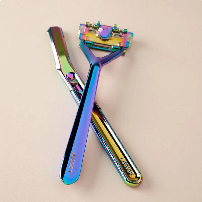 Leaf Prism Face and Body Dermaplaner set with stainless steel blade and mint green handle in leaf-shaped razor kit bundle