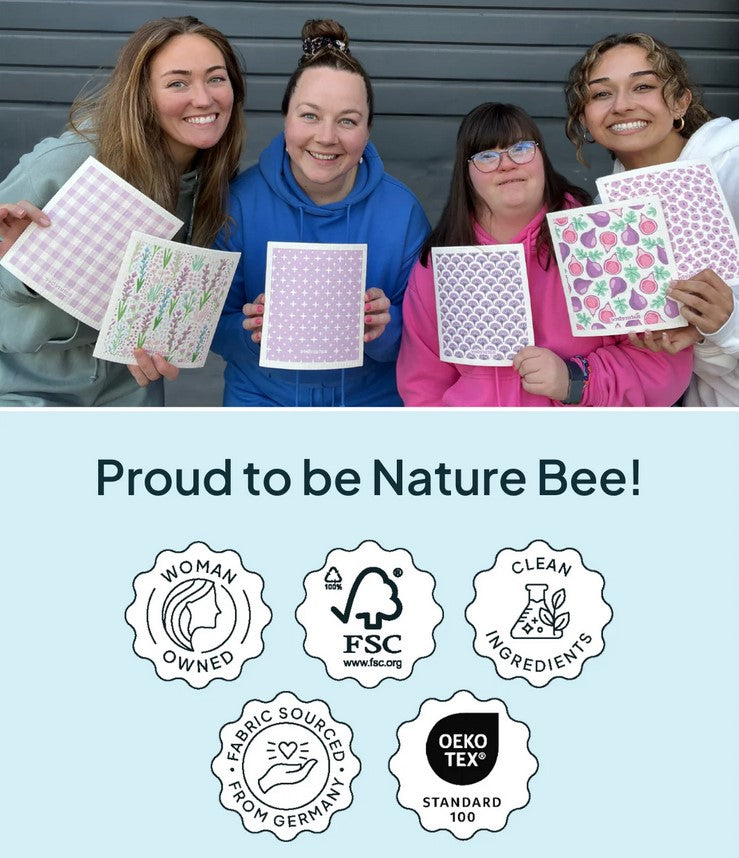 Close-up of purple bee sponge cloth's textured surface and intricate embroidery detail on the corner edge.