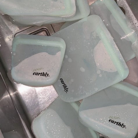 Colorful silicone bags displayed open, revealing vibrant, food-safe interior compartments ideal for storing locally-sourced