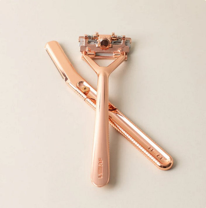 Leaf Rose Gold Face and Body Dermaplaner Set with leaf-shaped stainless steel razor, satin finish, and adjustable handle