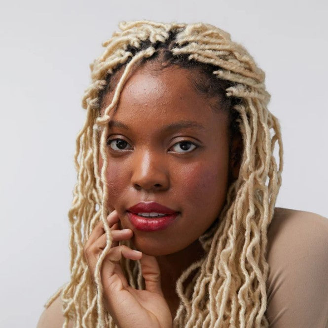 Close-up of Ruby Rebel Lip and Cheek Tint tube cap with embossed Birch Babe logo and vibrant red color detail