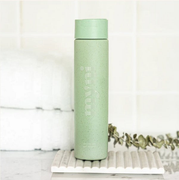 Close-up of Myni Shower Gel Starter Set label highlighting natural ingredients and subtle floral scent design