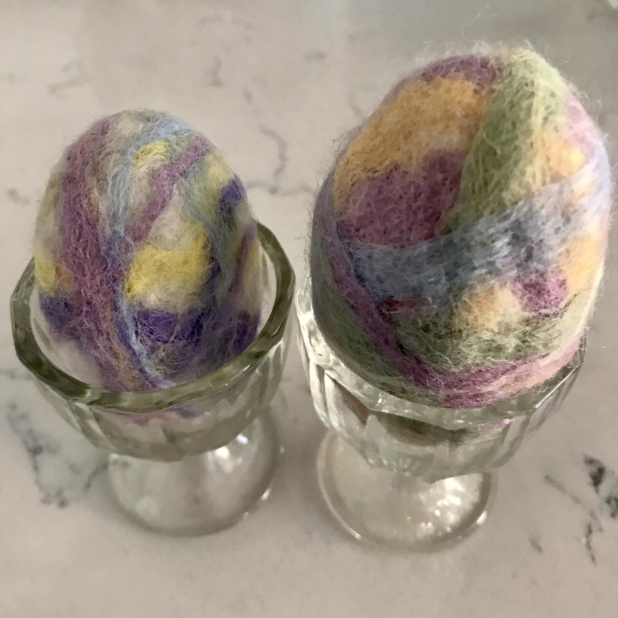 Close-up of the felted soap’s textured surface with visible wool fibers and subtle Easter egg coloring details from this