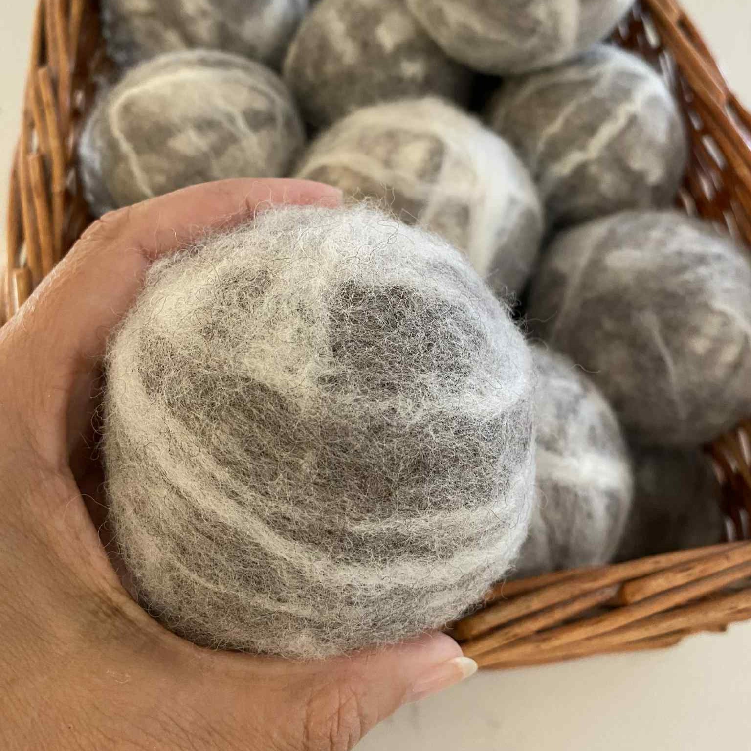 SNC Wool Dryer Balls XL made of natural white felted wool with textured surface, measuring approximately 3 inches in diameter