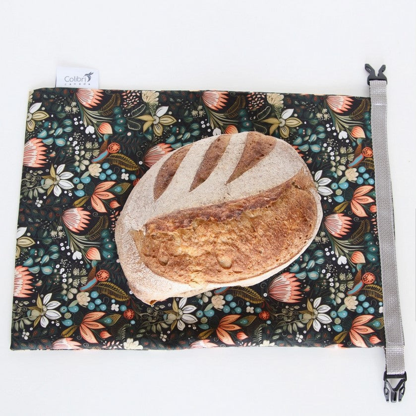 Flat lay of Colibri Penny Lane reusable bread bag with sourdough loaf