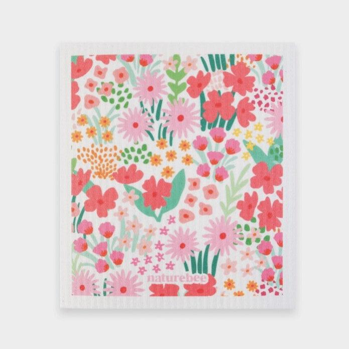 Close-up of the Pink Nature Bee Sponge Cloth's textured surface showing bee and flower embossed details for added grip and