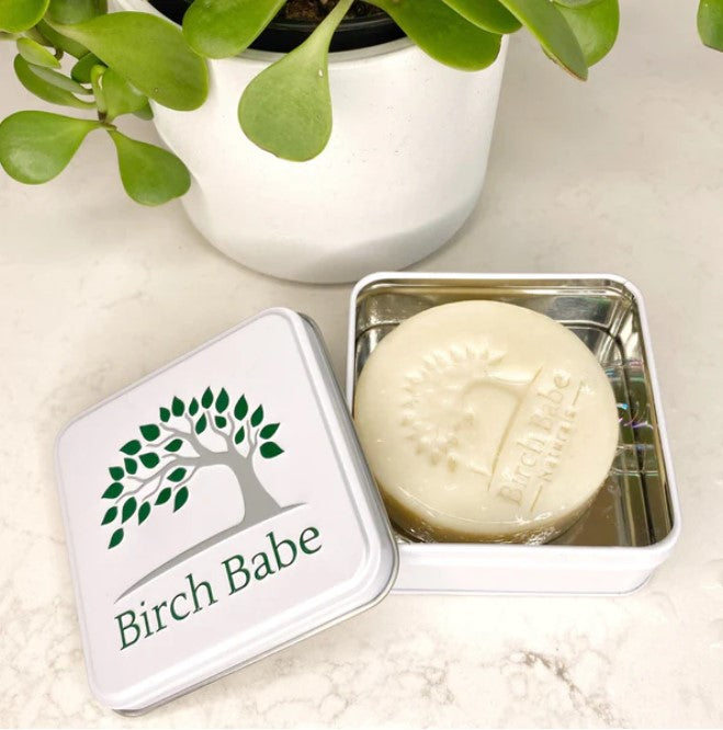 Reusuable Birch Babe travel tin with textured matte silver finish, displaying a hinged lid and compact 4-inch diameter side