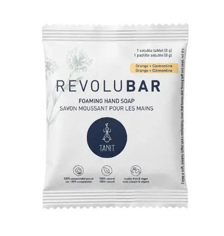 A single REVOLUBAR foaming hand soap tablet in its white resealable packaging, featuring the brand name, 'TANIT' logo, and orange citrus scent details on a clean white background.