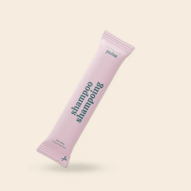 Close-up of Myni Shampoo bottle neck highlighting eco-friendly, recyclable packaging with farm-raised ingredients and