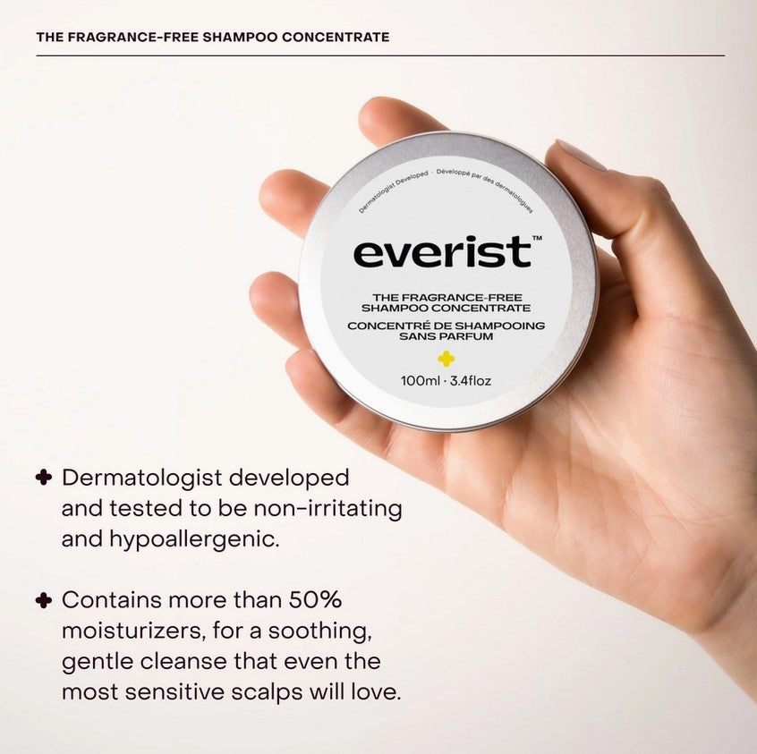 Close-up of the Everist Shampoo Concentrate Tin’s minimalist fragrance-free label and textured matte finish surface.