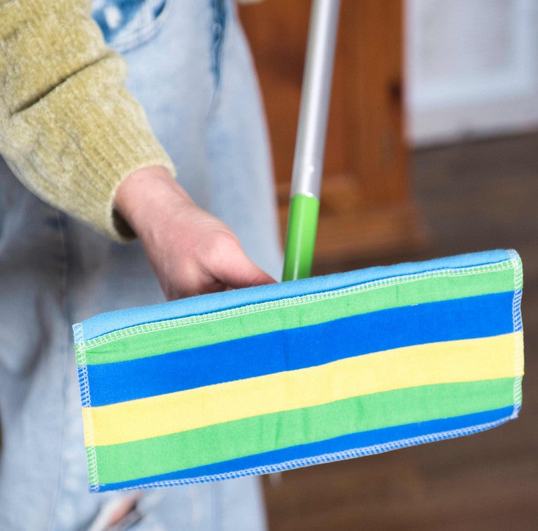 Close-up of reusable mop pad fibers showing textured weave and absorbent surface detail at an angle