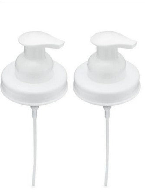 Set of two white foaming soap pump lids for mason jars on a white background