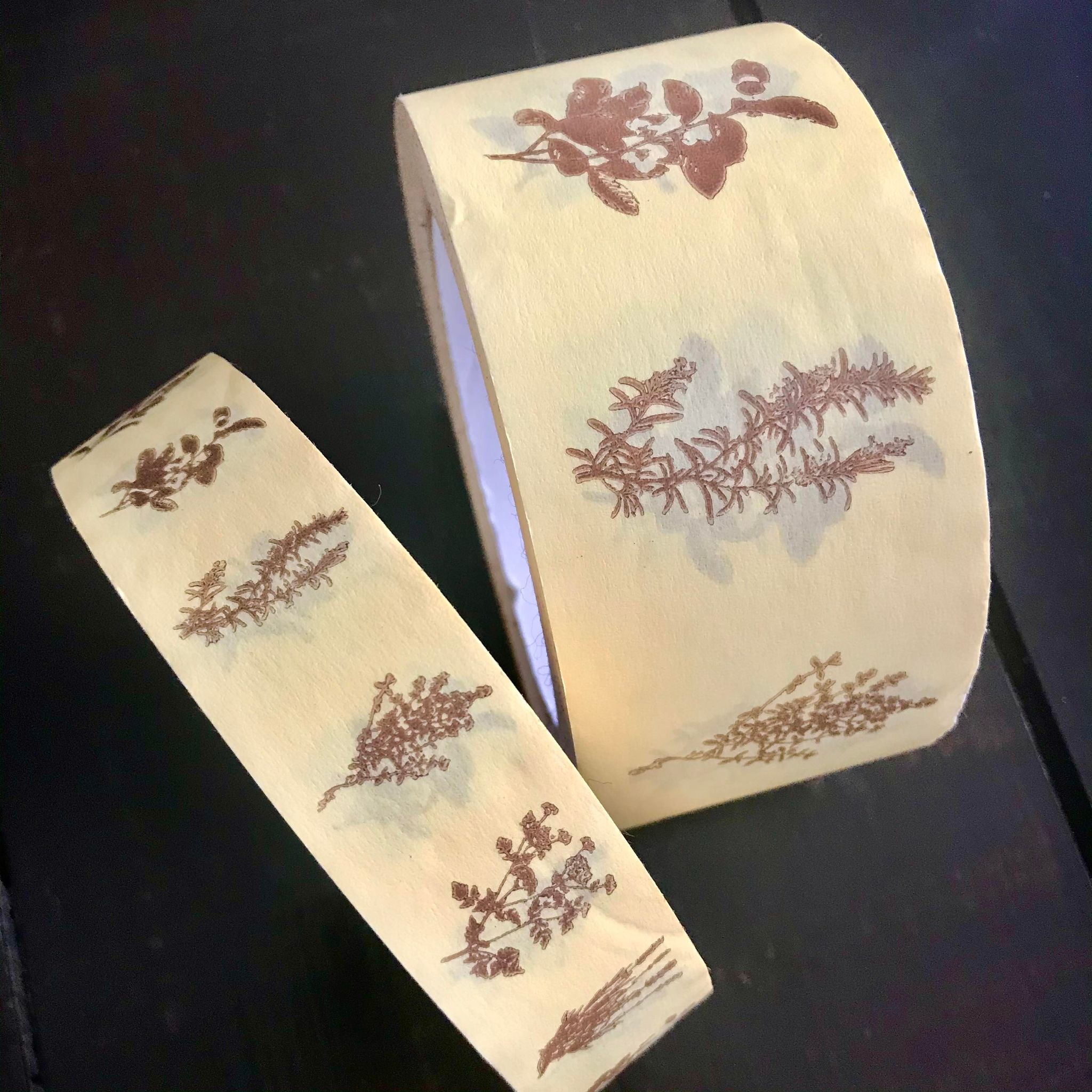 Close-up of the eco-friendly paper tape’s textured surface showing natural fibers and eco-conscious branding details.