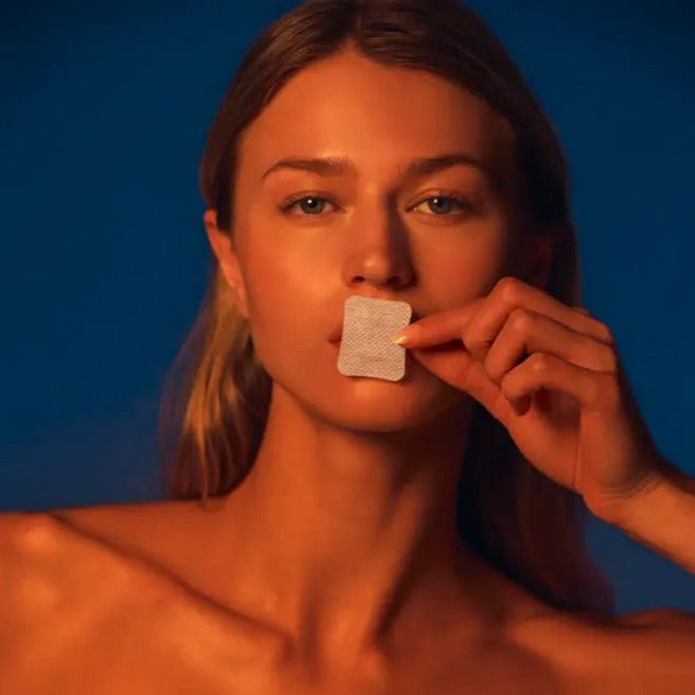 Close-up of the transparent mouth tape strip showing textured surface and precise 10mm width for optimal adhesion