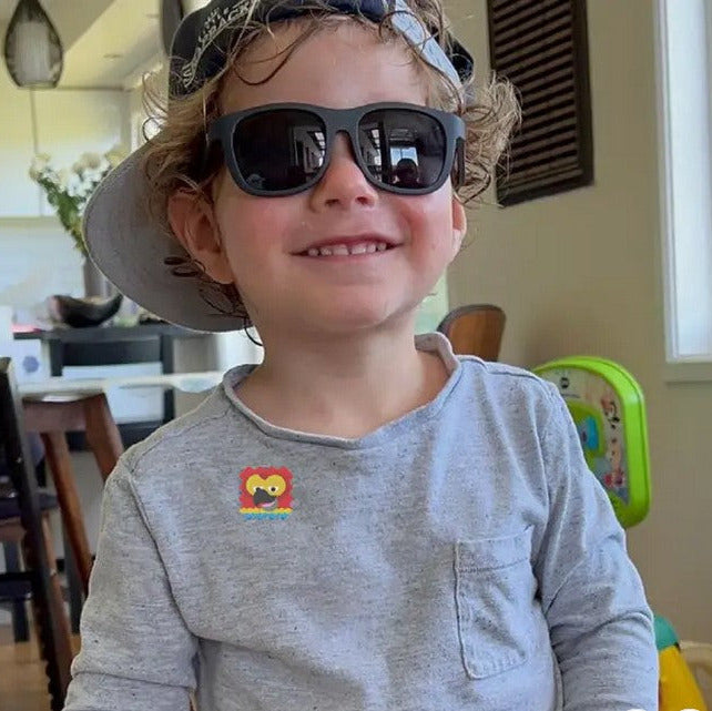 Close-up of NATPAT AllergyPatch stickers showing transparent, flexible adhesive material and detailed allergen warning label