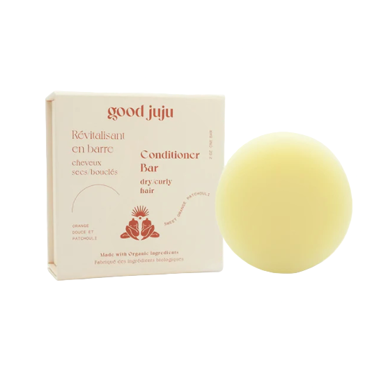 Good Juju conditioner bar for dry, curly hair featuring nourishing natural ingredients, smooth texture, and fresh botanical