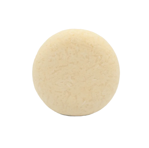 Close-up of the Good Juju Shampoo Bar's textured surface with subtle natural scent notes visible on the label
