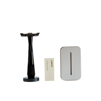 Leaf Shave Twig Razor Kit in matte black with stainless steel handle and black textured grip, includes adjustable safety