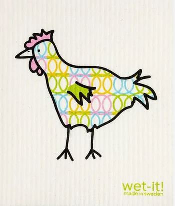 Close-up of textured Swedish Cloth fibers showcasing durability and absorbency, with vibrant color accents on a kitchen