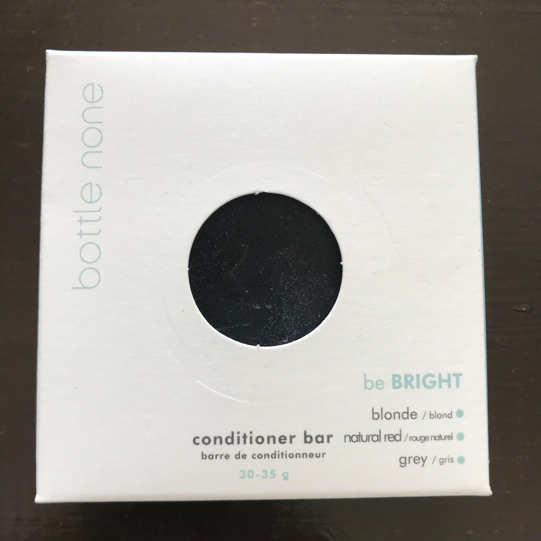 Bottle None be BRIGHT hair conditioner bar in red, blonde, or grey, with smooth texture, natural ingredients, and fresh