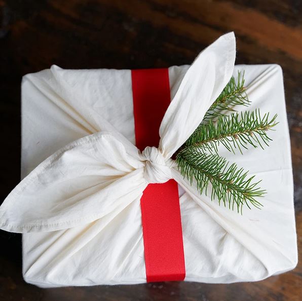Close-up of the hand-stitched hemp handle and textured cotton fabric displaying natural fiber details of the Bento Bag.
