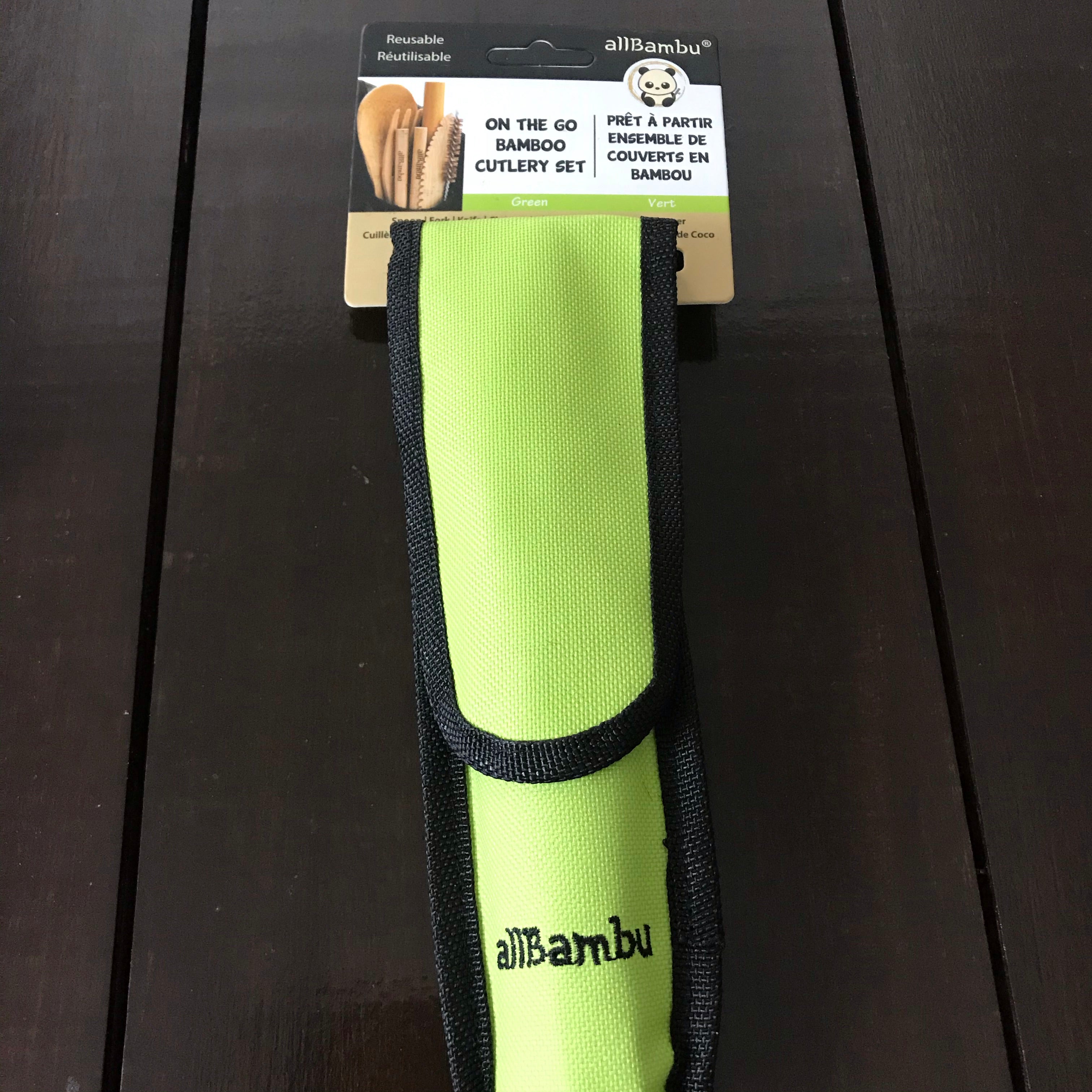 Close-up of bamboo handles and stainless steel blades on the travel cutlery set, highlighting eco-friendly material and