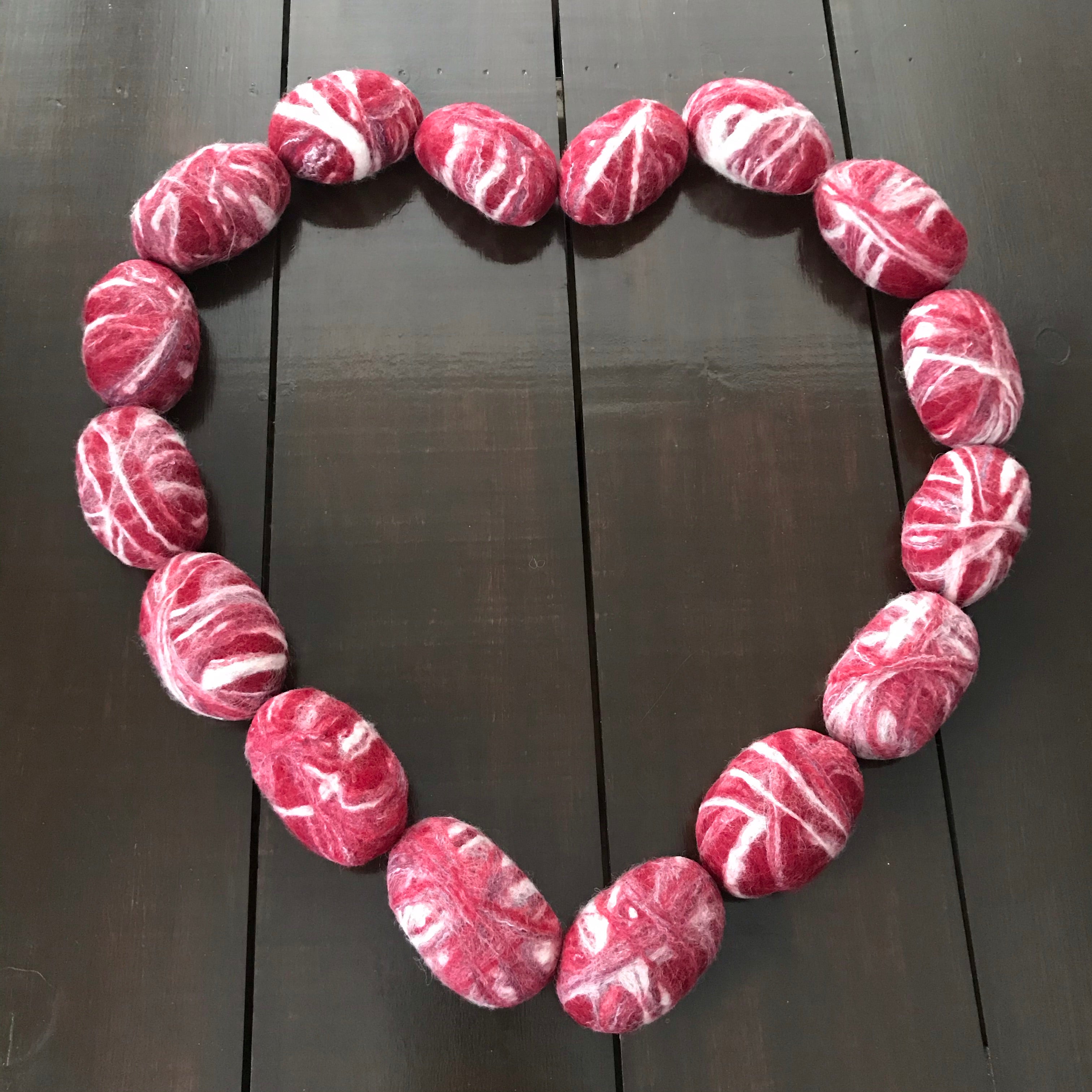 Close-up of the felted apple cinnamon soap’s textured surface revealing intricate wool fibers and subtle cinnamon-colored