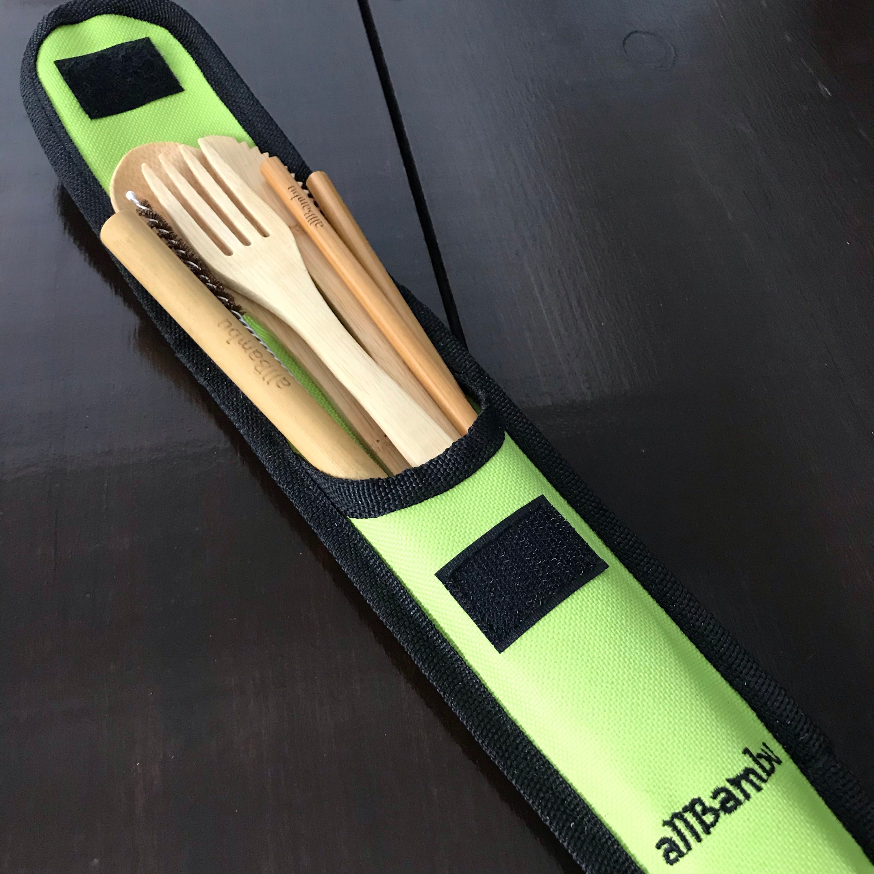 Close-up of the bamboo handle and smooth finish on a travel cutlery set with compact stacking design