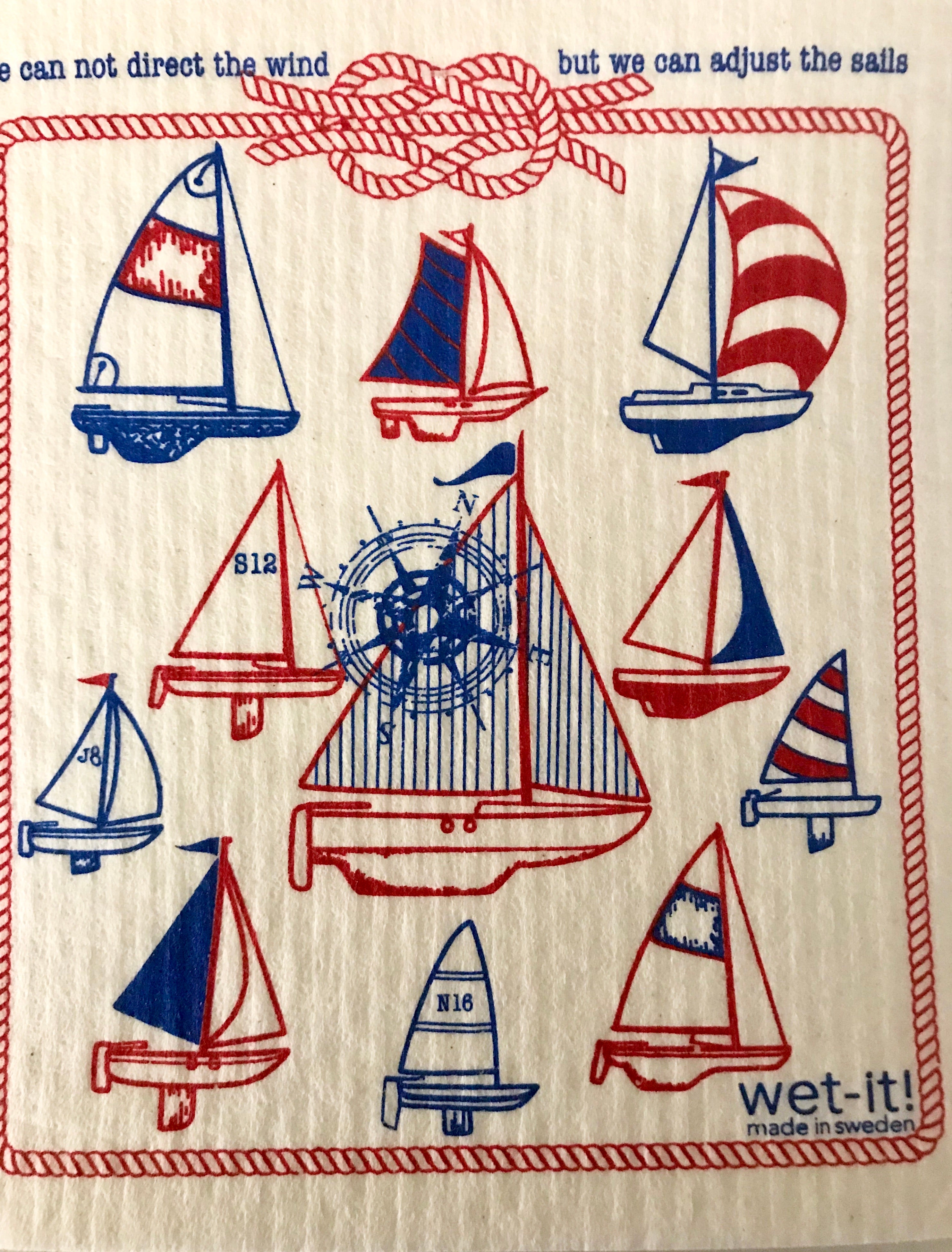 Close-up of textured Swedish dishcloth fabric with vibrant print details and woven edges at a slight diagonal angle