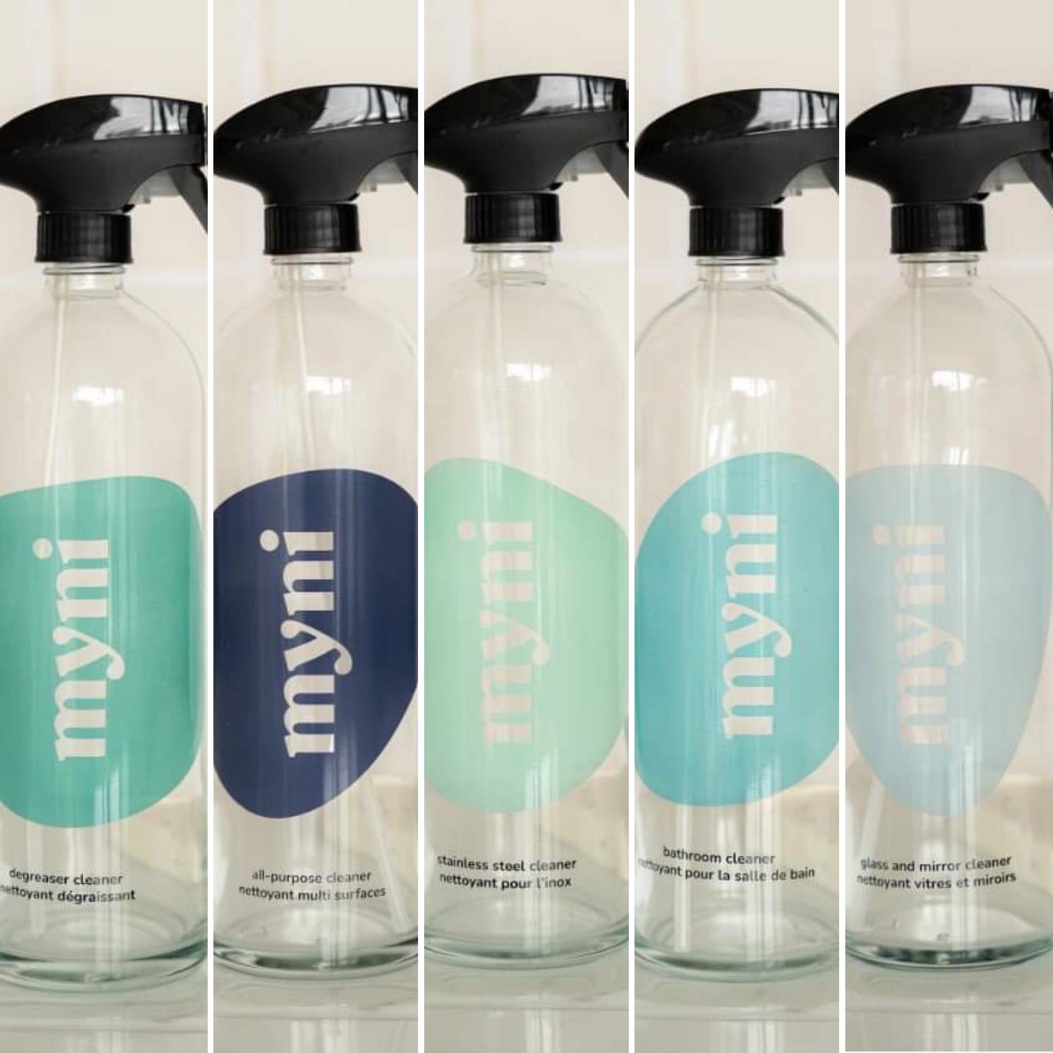 Myni reusable glass spray bottle with 750ml capacity, clear biodegradable material, in kitchen or bathroom setting
