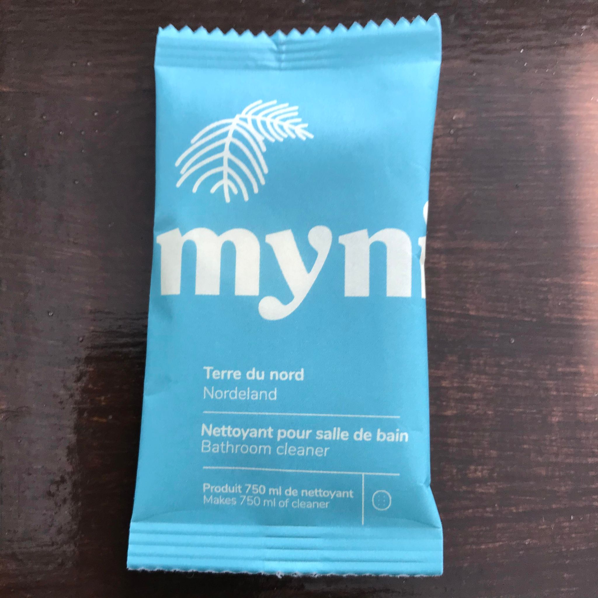 Close-up of Myni Bathroom Cleaning Tablets packaging highlighting the textured label with instructions and eco-friendly icons