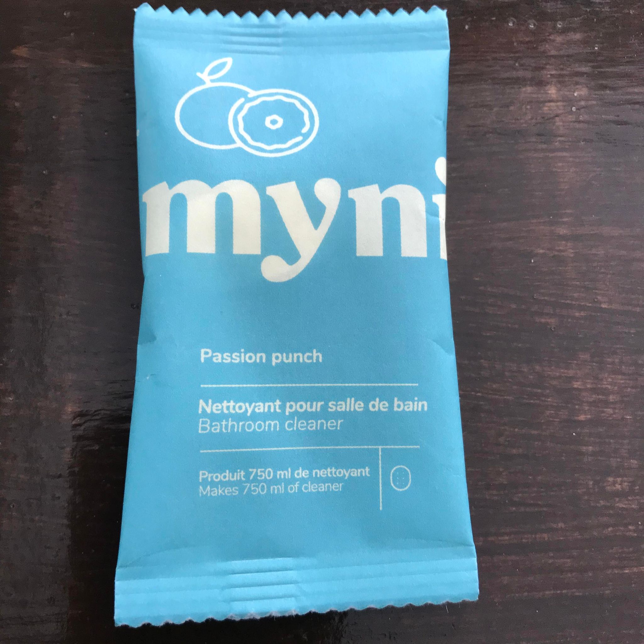 Close-up of Myni Bathroom Cleaning Tablets showing textured surface and embossed branding on the packaging