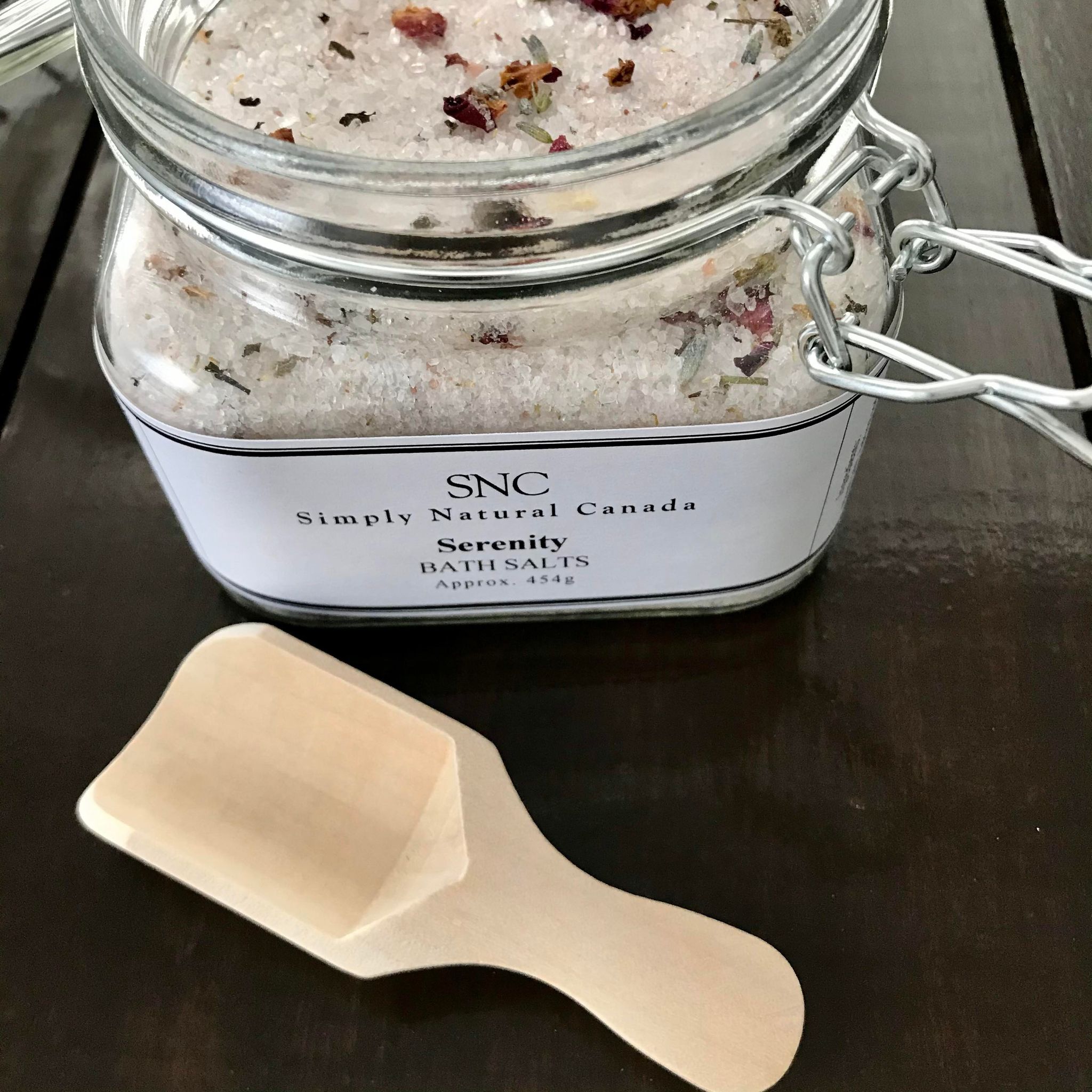 Serenity Bath Salts in resealable kraft paper bag with dried lavender flowers, pink Himalayan salt crystals, and
