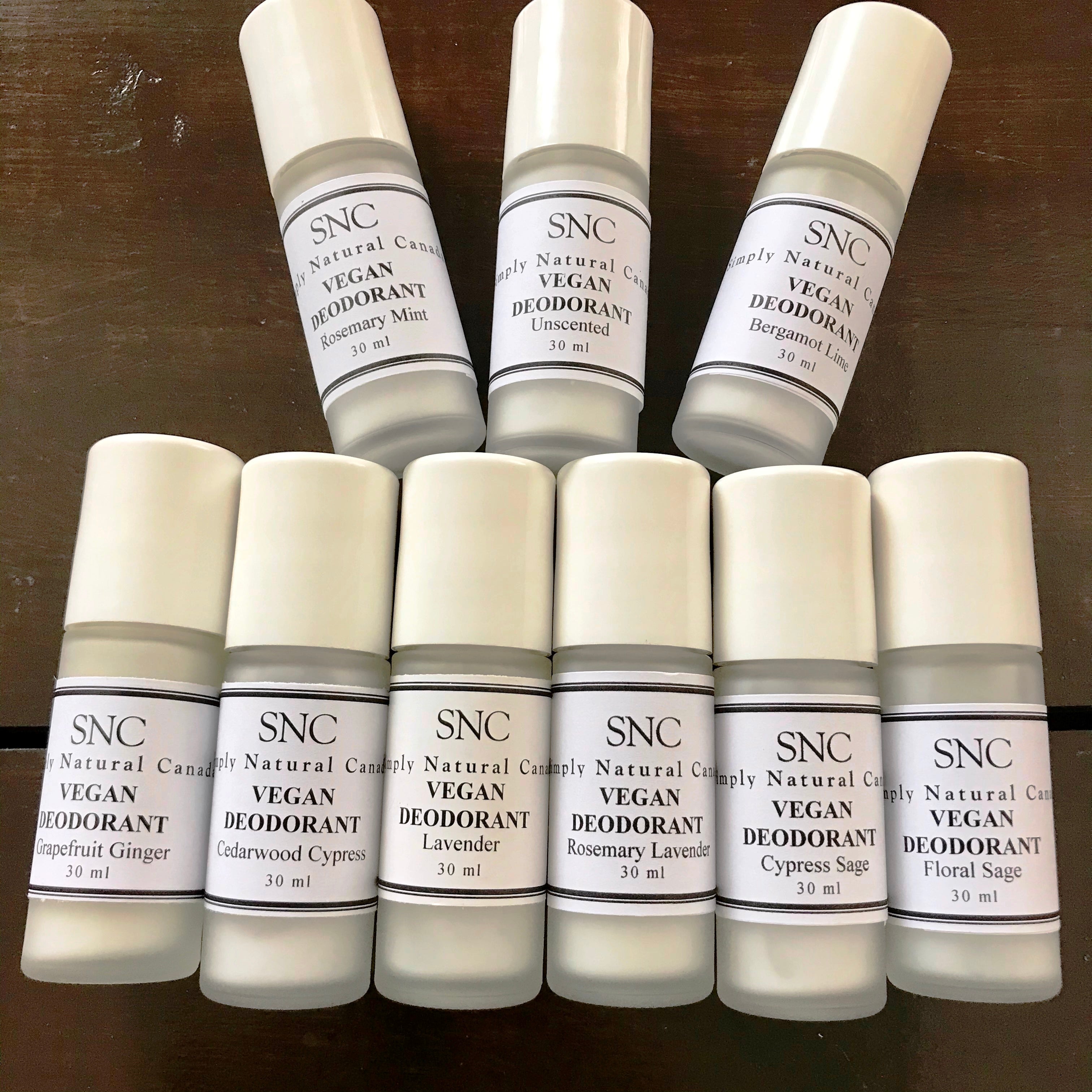 Simply Natural Canada vegan roll-on deodorant in clear glass bottle with white plastic cap, smooth texture, and minimalist