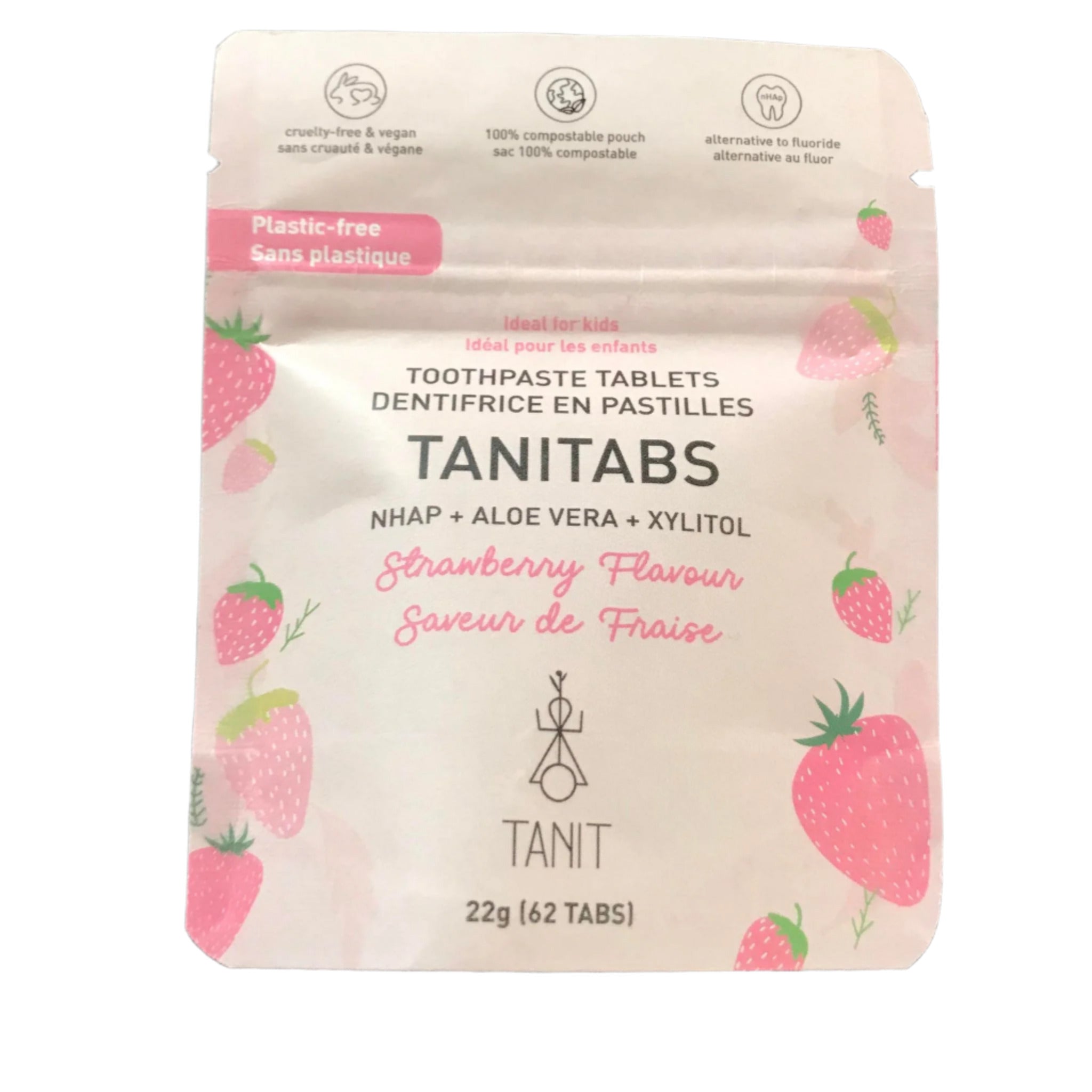 Close-up of strawberry-flavored toothpaste tablets in clear plastic container, illustrating individual round tablets and