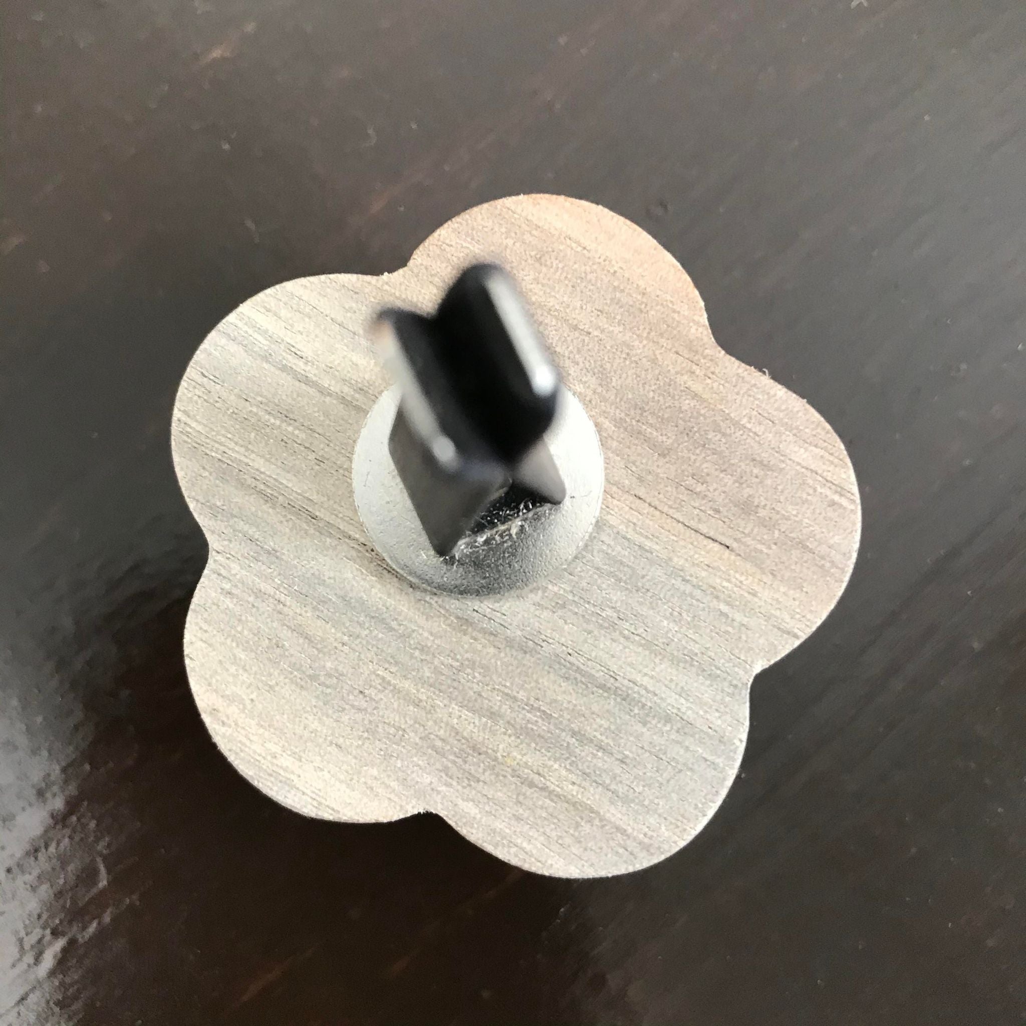 Close-up of the diffuser’s textured, matte black silicone surface with embedded aromatic resin beads, showing durability and